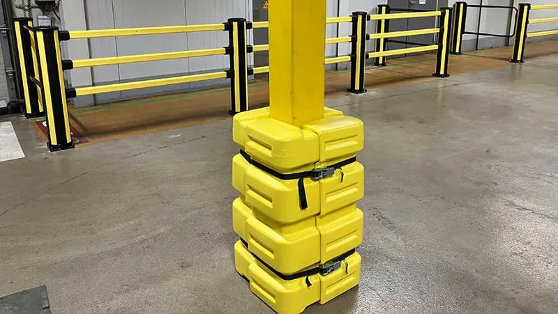 yellow column guard protecting a pillar in industrial environment 